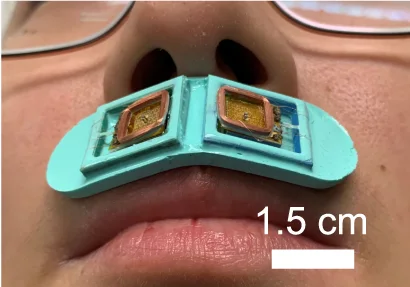 CityU skin-interfaced olfactory interface - Physical two-generator olfactory interface worn below the nose. Cropped from Figure 1d, bottom-right optical photograph, in the authors’ 2023 Nature Communications paper.