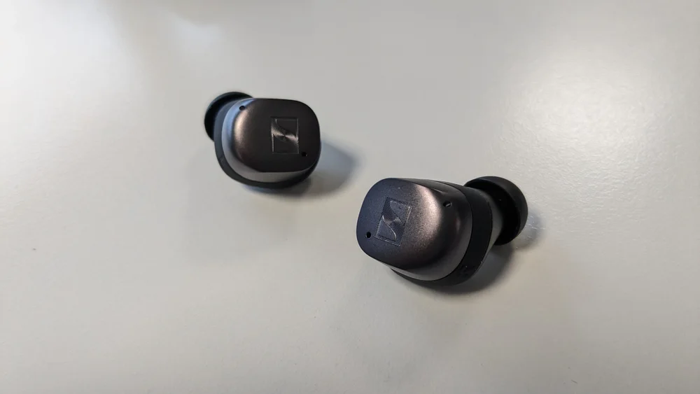 Sennheiser MOMENTUM True Wireless 4 - Original physical-device photograph of Sennheiser MOMENTUM True Wireless 4. SmartWearGuide has not hands-on tested this model. Photo/source credit: TechRadar / Future.