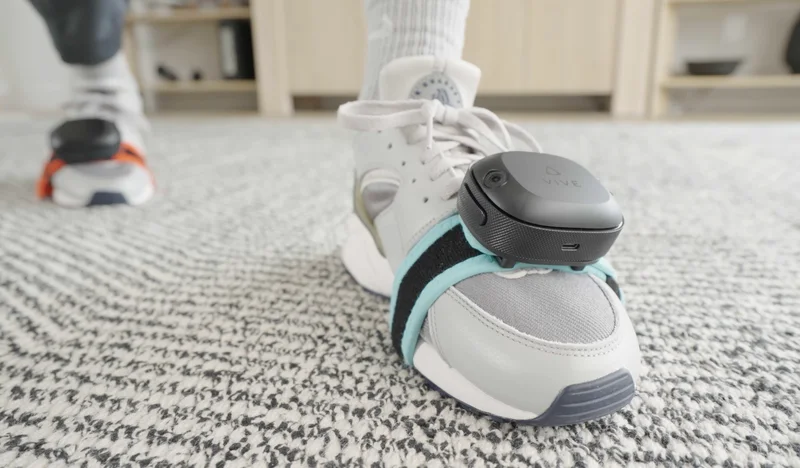 HTC VIVE Ultimate Tracker - Physical VIVE Ultimate Tracker attached to a shoe.